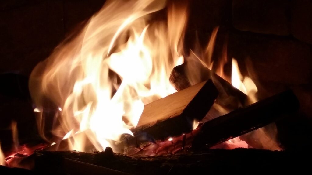 A fire pit and outdoor kitchen at Orchard Groves' Luxury Townhomes and Apartments near Buffalo NY